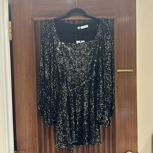 Black sequin dress. Mid thigh length. Never worn.
